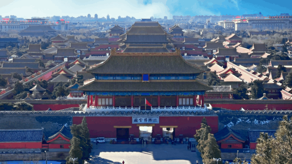 Golden roofs and ceremonial halls of the Forbidden City in Beijing, China, showcasing imperial architecture.