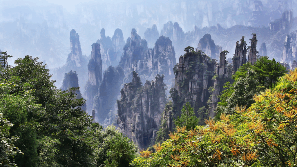 Towering sandstone pillars rising above the landscape in Zhangjiajie National Forest Park, Hunan Province.