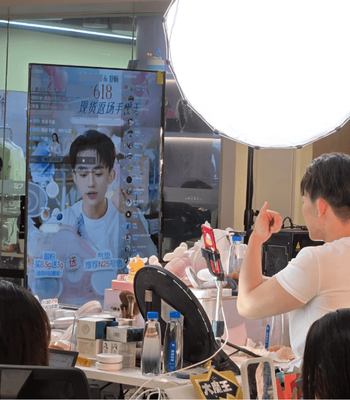 Male livestreamer presenting beauty products on Taobao