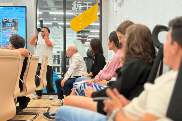 Tour group experiencing China's industry through immersive company visits